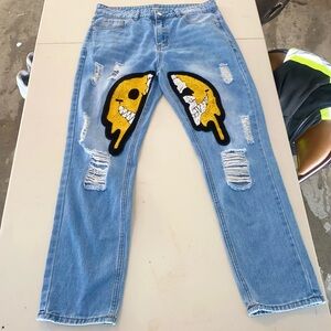 Blue Distressed Jeans with Yellow Graphic